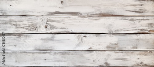 A closeup shot of a rectangular white wooden table with a grey hardwood flooring. The parallel patterns on the table create a monochrome photography effect