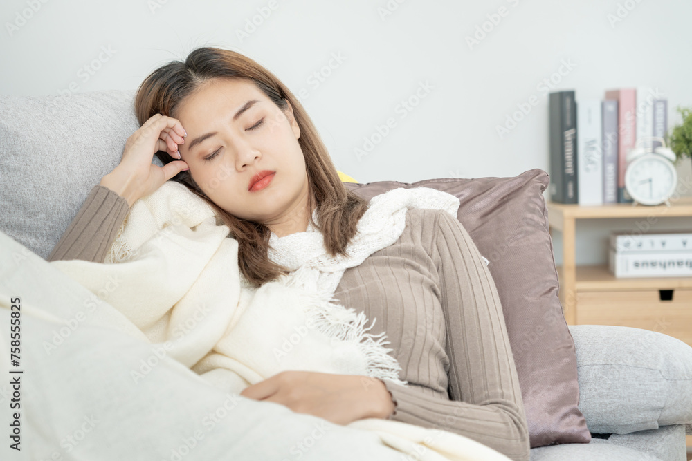 sick woman with a headache sitting under blanket, female sneezing and runny nose with seasonal influenza, allergic, high fever and influenza, resting, virus, coronavirus, feel illness, respiratory sick woman with a headache sitting under blanket, female sneezing and runny nose with seasonal influenza, allergic, high fever and influenza, resting, virus, coronavirus, feel illness, respiratory