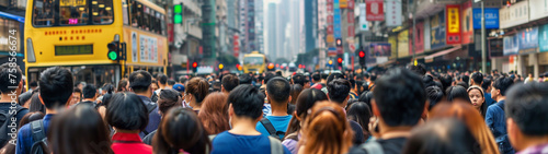 Many people in the crowd, back view of men and women walking to work or school on a City's street.