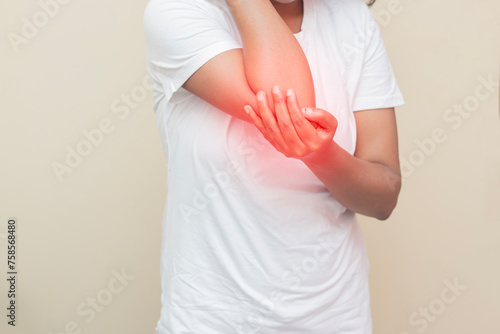 imitative representation of an Indian lady feeling elbow pain. 
