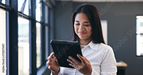 Happy asian woman, tablet and research in office, social media or communication for networking. Female person, employee and smile for tech or online chatting, typing and market research in workplace