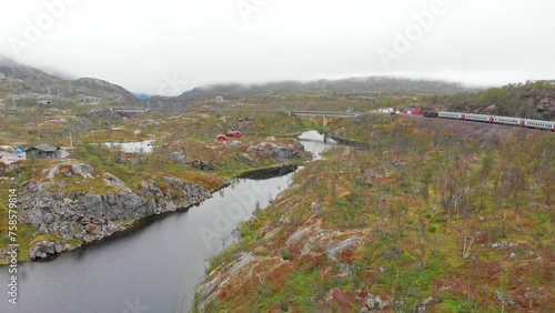 Aerial: Swedish passenger train in northern Norway close to Søsterbekk station by a lake photo