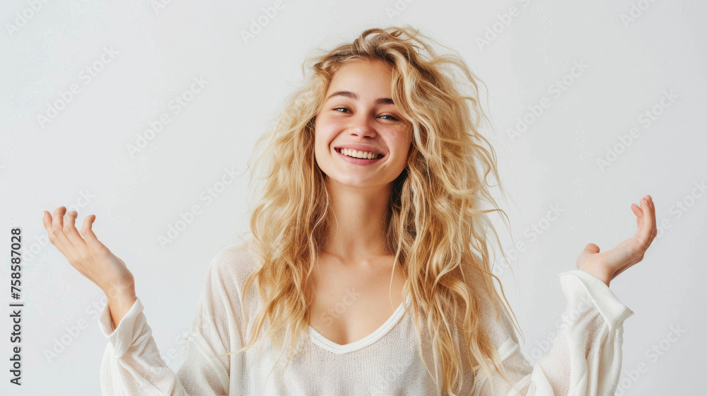 Vivacious young woman laughing and throwing her hands up in a carefree manner Vivacious young woman laughing and throwing her hands up in a carefree manner