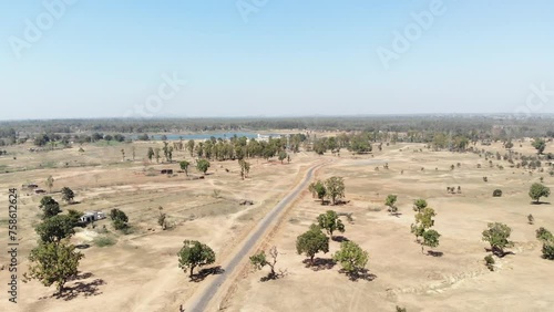 Aerial wide shot of barren land with asphalt road in Charu village in Chatra, Jharkhand, India. Jharkhand Tourism. photo