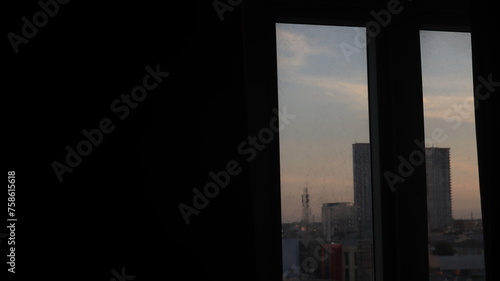 tall buildings visible from behind the hotel window