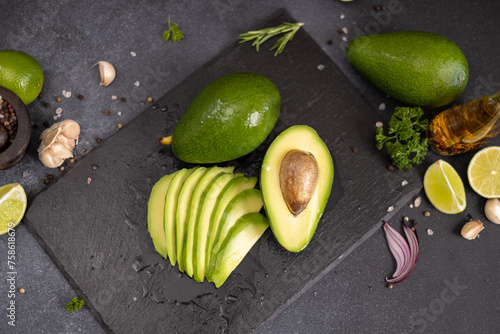 Green Avocado on stone serving board