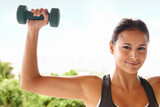 Portrait, dumbbell or woman outdoor for exercise, training or workout for power in nature. Face, strong or person weightlifting for fitness, health or bodybuilding to flex muscle for wellness at park