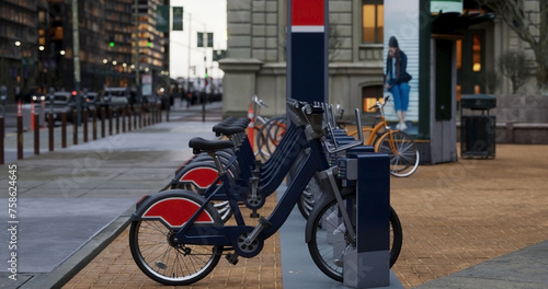 Generic Electric bicycle charging station. Shared electric bikes parked for rent on city street