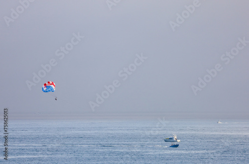 Two people parasailing in Mission Beach, California.