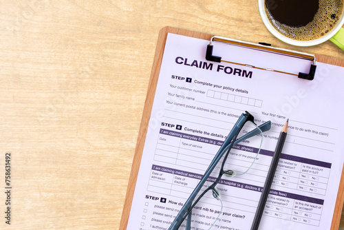 Medical claim form on wooden table photo