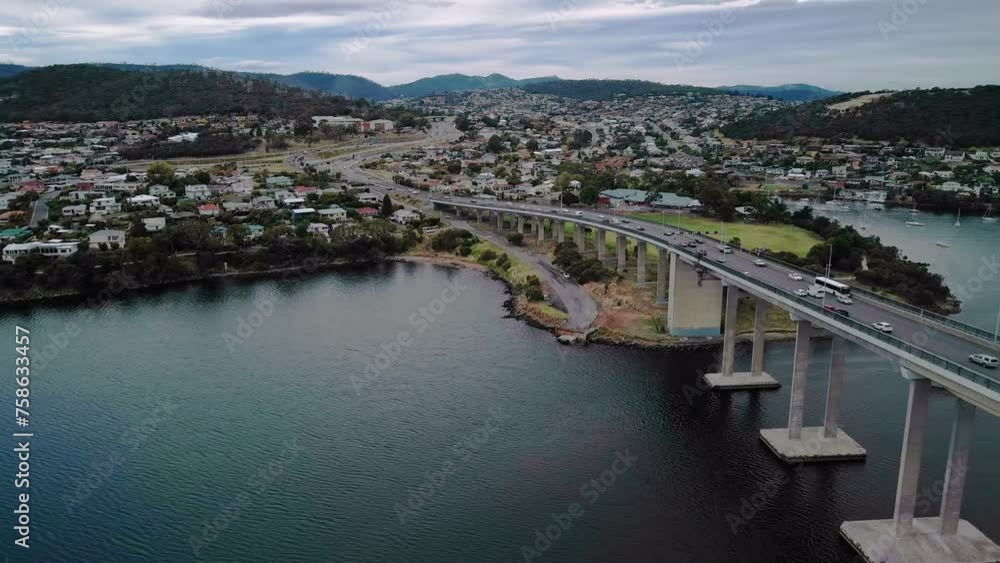 Aerial view of a crowded city with bridge in foreground. Aerial view of a crowded city with bridge in foreground.