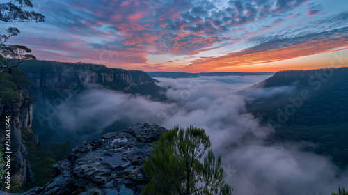 Wide-angle photo of a breathtaking mountain vista at sunrise, misty valleys below adding to the serene atmosphere