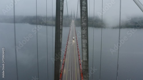 Truck going over the big bridge Höga Kusten in northern part of Sweden photo