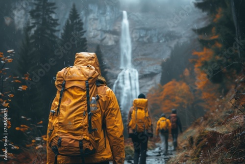 Autumn Adventure: Friends on a Misty Trail to a Secluded Waterfall