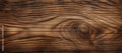 A closeup of a brown hardwood plank with a beautiful grain pattern. The natural material of wood flooring showcases the beauty of wood stain