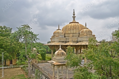 Majestic Royal Cenotaphs Amidst Verdant Greenery Under Cloudy Skies at Maharani Ki Chhatri ,Jaipur, Rajasthan, India