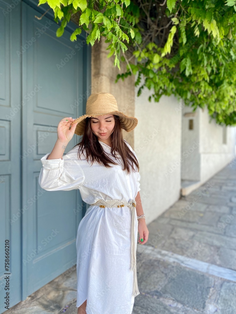 portrait of a woman in a  straw hat on vacation in Aphenes