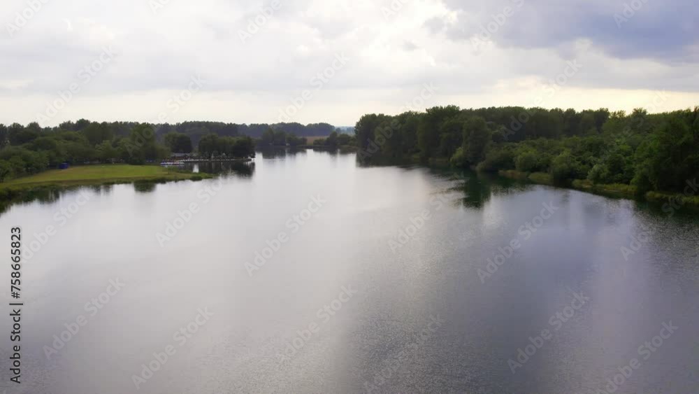 Dark clouds covering sky above peaceful lake in Bela Crkva, Serbia