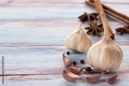Fototapeta Naklejka Na Ścianę i Meble -  Close up garlic on a wooden table background