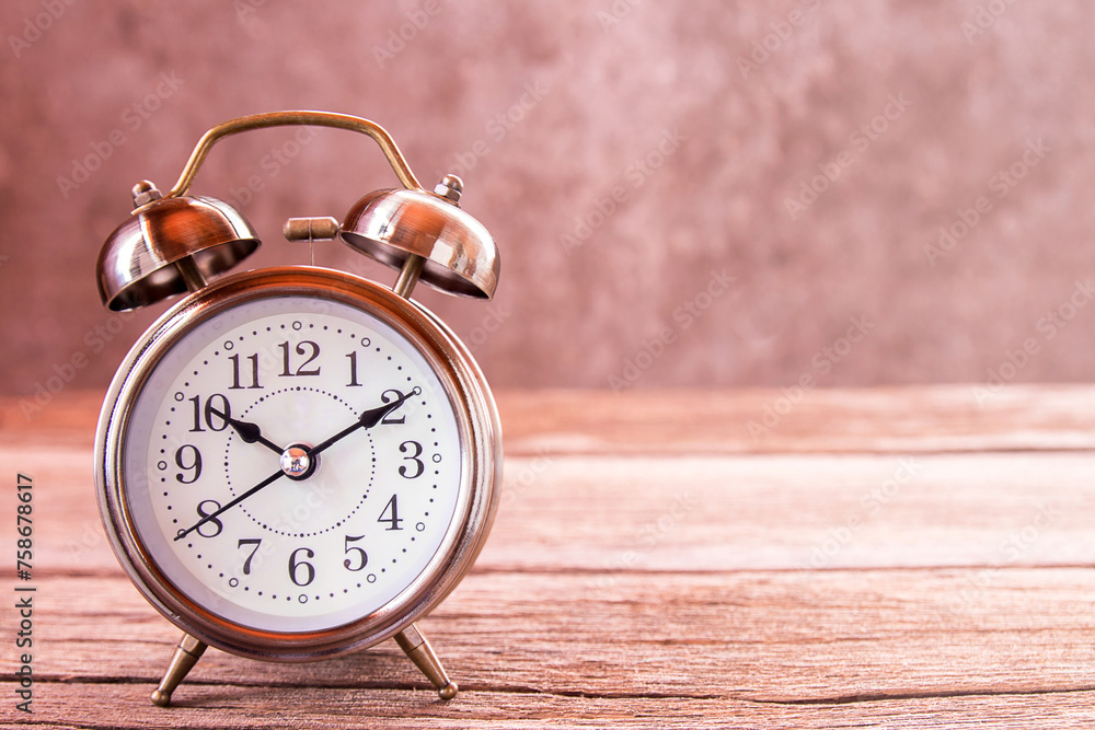 Retro alarm clock on a wooden table. Retro alarm clock on a wooden table.