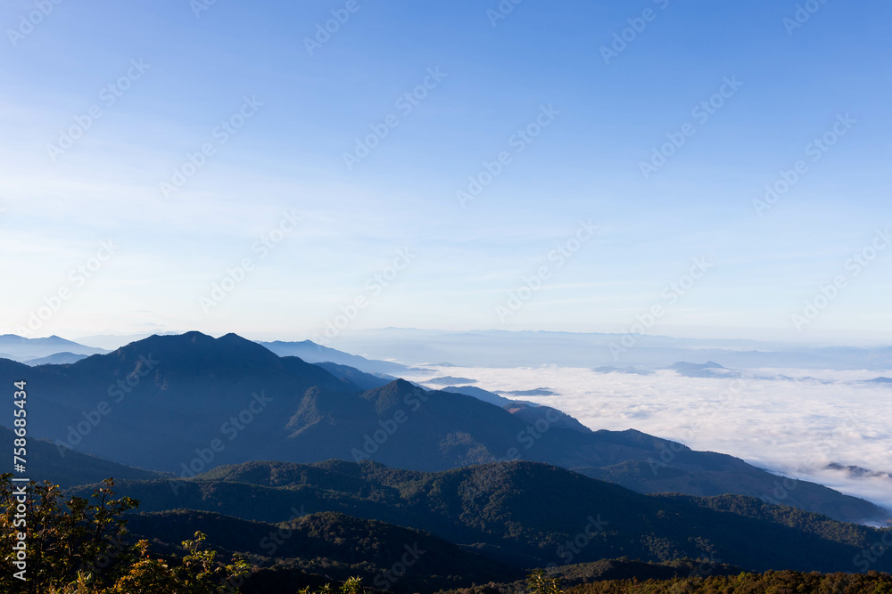 Sea of mist and clouds view from Mt. Doi Inthanon - the highest peak in Thailand. Doi Inthanon National Park. Landscape of North Thailand.