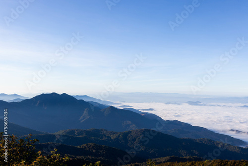 Sea of mist and clouds view from Mt. Doi Inthanon - the highest peak in Thailand. Doi Inthanon National Park. Landscape of North Thailand.