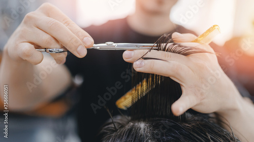Concept Barbershop for man. Closeup master hairdresser does hairstyle and style with scissors and comb