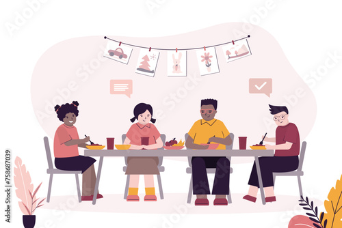Group of multiethnic schoolchildren sit at table and eat. Lunch break at school. Classmates eat together at desk. Healthy lifestyle.