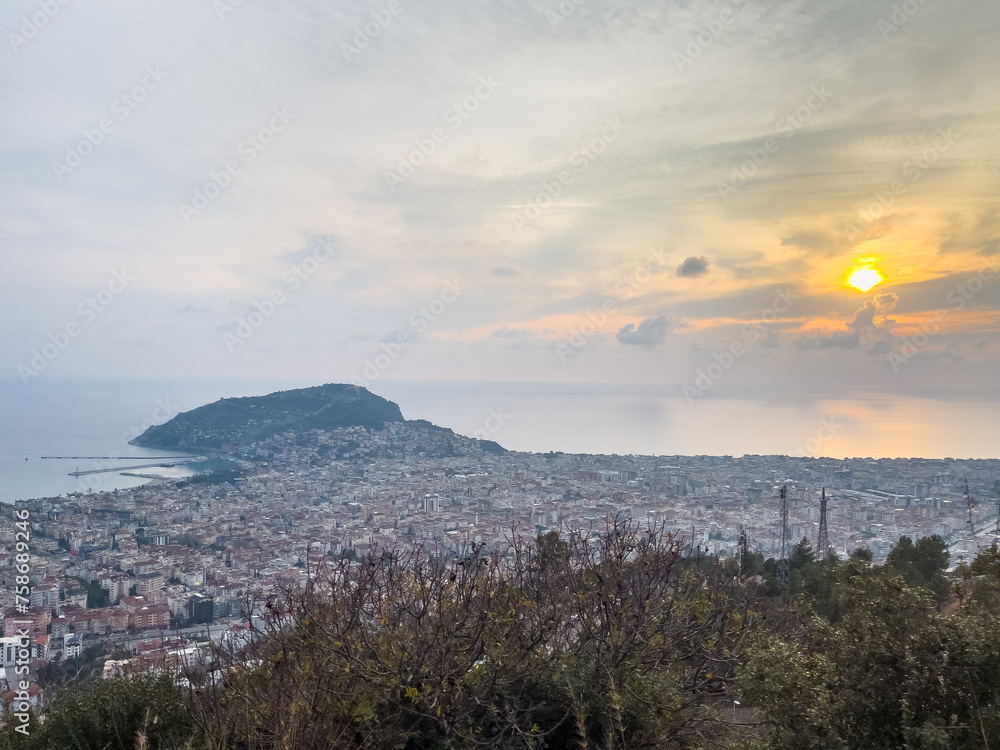 Aerial View of Alanya Castle and Sea. Sunset in a winter day with yellow sun Aerial View of Alanya Castle and Sea. Sunset in a winter day with yellow sun