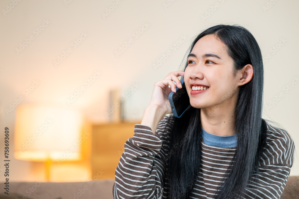 Women doing activities inside the house Communicate via smartphone happily Women doing activities inside the house Communicate via smartphone happily