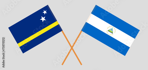 Crossed flags of Country of Curacao and Nicaragua. Official colors. Correct proportion