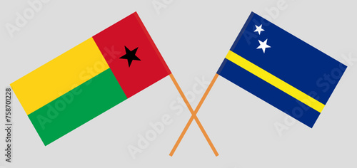 Crossed flags of Guinea-Bissau and Country of Curacao. Official colors. Correct proportion