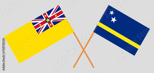 Crossed flags of Niue and Country of Curacao. Official colors. Correct proportion