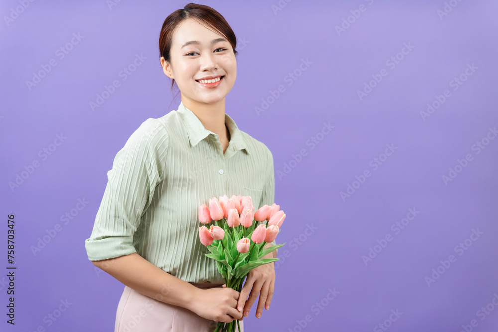 Photo of young Asian woman on purple background Photo of young Asian woman on purple background