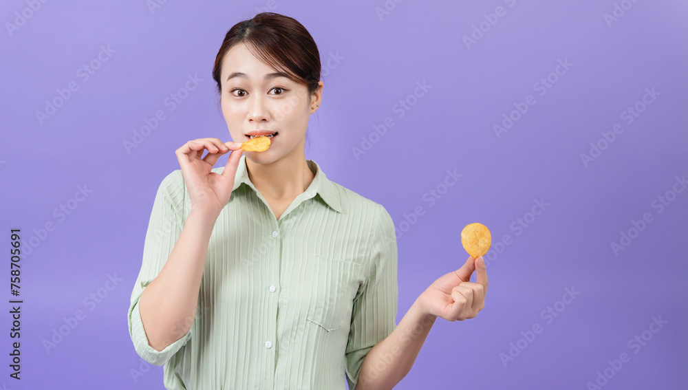 Photo of young Asian woman on purple background Photo of young Asian woman on purple background