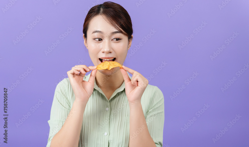 Photo of young Asian woman on purple background Photo of young Asian woman on purple background