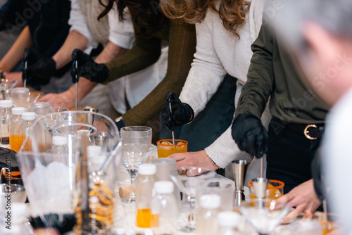 Group Cocktail Workshop: Participants Learning Mixology Techniques While Crafting Fresh and Creative Drinks with Premium Ingredients