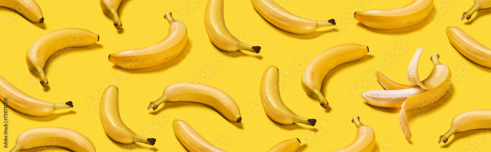 Banner bananas with hard shadows pattern on yellow background Banner bananas with hard shadows pattern on yellow background