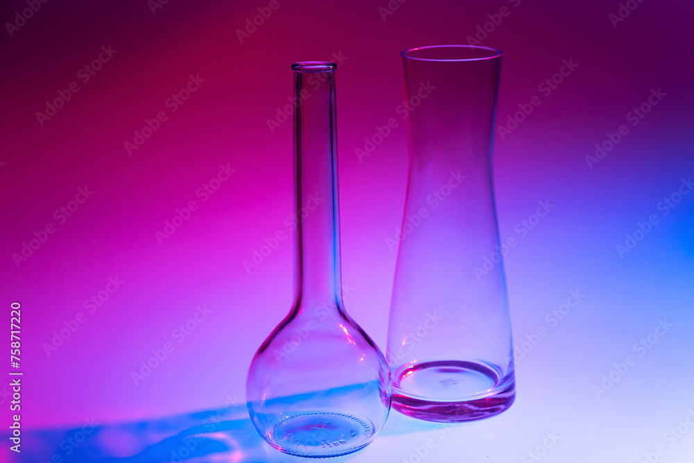 Close-up of two decorative glass vases on a red, blue and violet colored background Close-up of two decorative glass vases on a red, blue and violet colored background