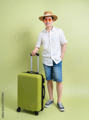 Photo of young Asian man on green background