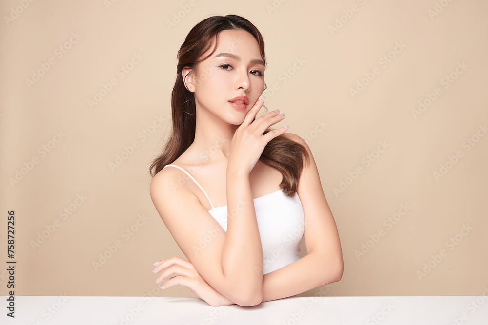 Beautiful young asian woman with clean fresh skin on beige background, Face care, Facial treatment, Cosmetology, beauty and spa, Asian women portrait. Beautiful young asian woman with clean fresh skin on beige background, Face care, Facial treatment, Cosmetology, beauty and spa, Asian women portrait.