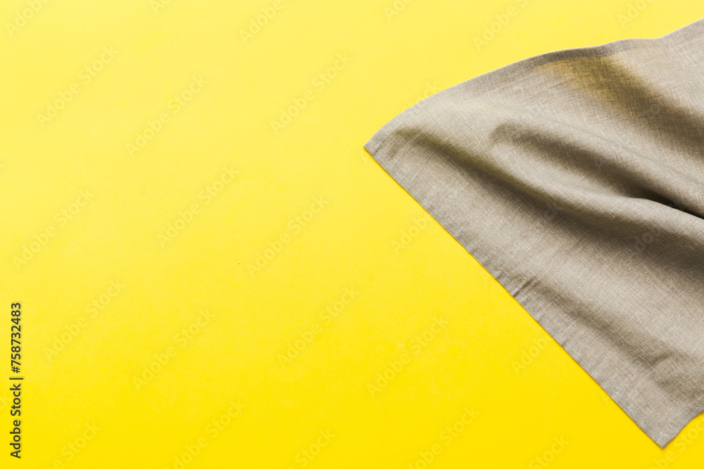 top view with gray kitchen napkin isolated on table background. Folded cloth for mockup with copy space, Flat lay. Minimal style top view with gray kitchen napkin isolated on table background. Folded cloth for mockup with copy space, Flat lay. Minimal style