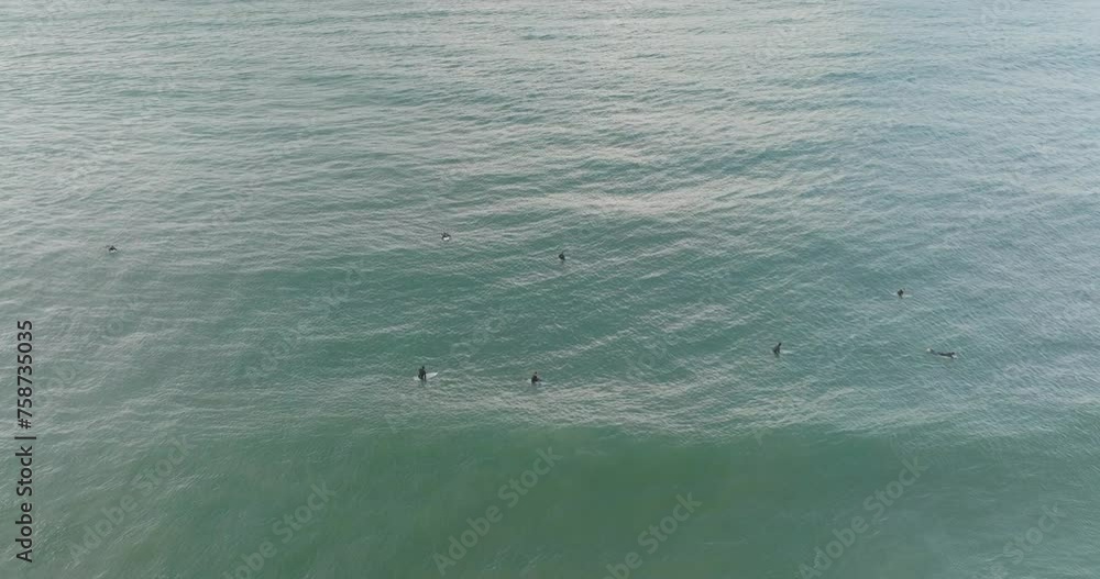Aerial view of sea and surfers, Peniche, Portugal. Aerial view of sea and surfers, Peniche, Portugal.