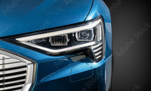 Blue car headlight close-up