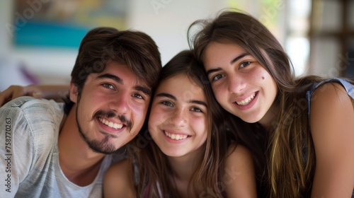 An Argentinian family trio is posing together for a group picture, smiling and standing closely. The parents and child are looking at the camera, capturing a moment of togetherness.