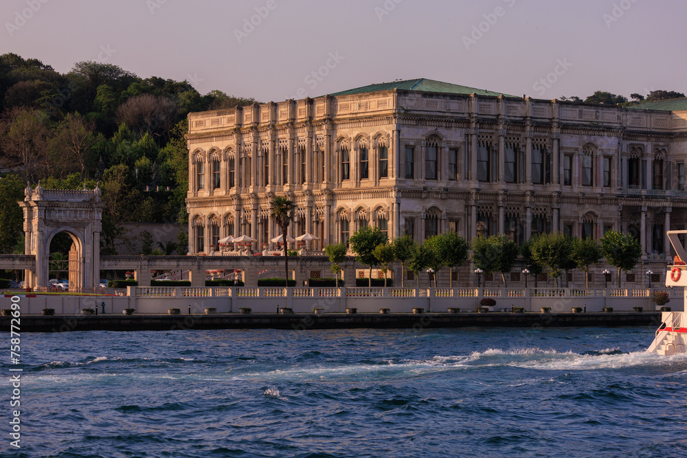 View from the water of the Bosphorus Strait to ancient palaces and buildings. Public place on the street of Istanbul, Türkiye.