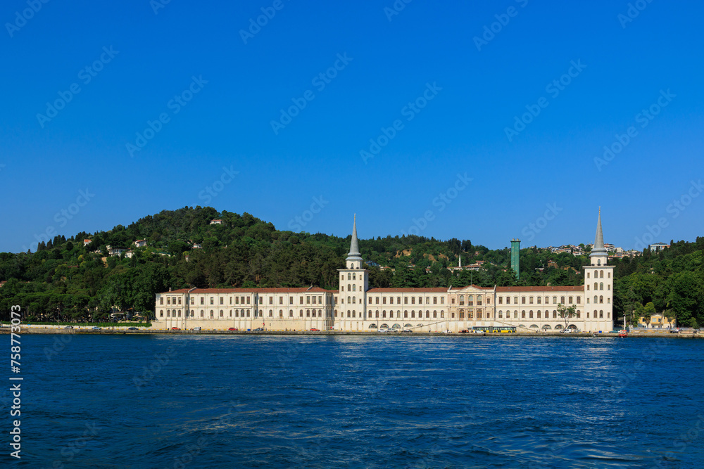View from the water of the Bosphorus Strait to ancient palaces and buildings. Public place on the street of Istanbul, Türkiye.