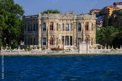 View from the water of the Bosphorus Strait to ancient palaces and buildings. Public place on the street of Istanbul, Türkiye. © Kozlik_mozlik
