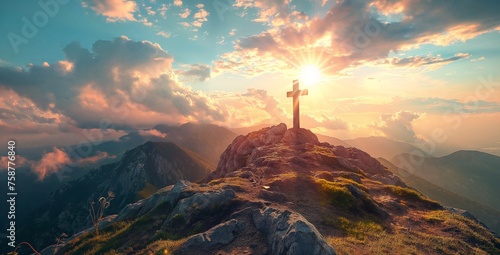 Silhouettes of crucifix symbol on top mountain with bright sunlight on the colorful sky background.