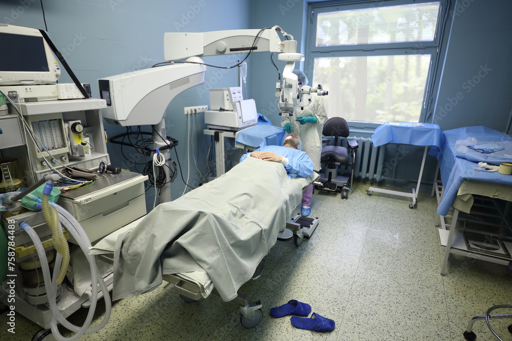 Doctor is doing surgery to patients eye at the center of endosurgery and lithotripsy. Doctor is doing surgery to patients eye at the center of endosurgery and lithotripsy.